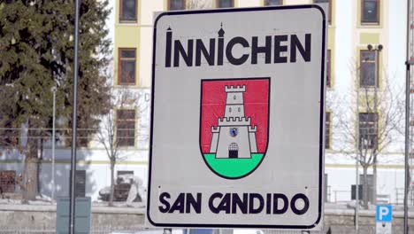 Village-sign-of-Innichen---San-Candido,-South-Tyrol,-Italy-with-town-name-and-coat-of-arms