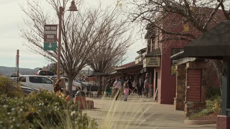 Downton-Sedona,-Arizona-with-shoppers-walking-on-sidewalk-with-stable-wide-shot