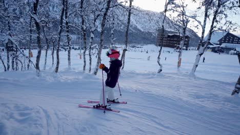 Young-girl-skiing-in-forest-slope-at-Myrkdalen-ski-resort-Norway,-slow-motion