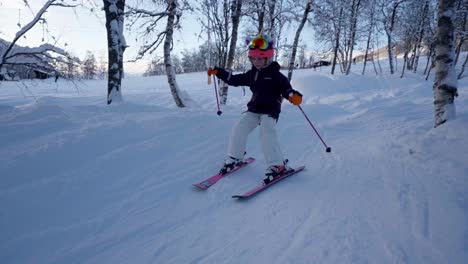 Cute-young-girl-skiing-and-falling-in-Myrkdalen-Norway,-slow-motion