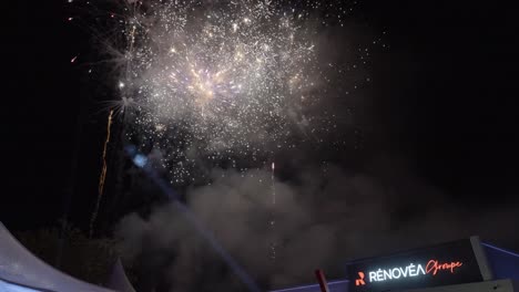 Scenic-firework-show-at-a-new-years-eve-business-event,-celebrating-the-new-year-with-a-firework-show