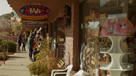 Downton-Sedona,-Arizona-with-shoppers-walking-on-sidewalk-with-stable-medium-shot