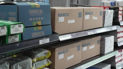 Shelf-inside-truck-and-auto-parts-distributor-store,-displaying-several-Wabco-branded-boxes