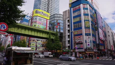 Slow-motion-establishing-shot-of-Akiba,-Game-stores-and-Maid-Cafes-in-Background