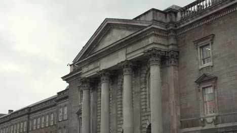 Georgian-architecture,-trinity-college,-large-columns,-establisher-cloudy-day