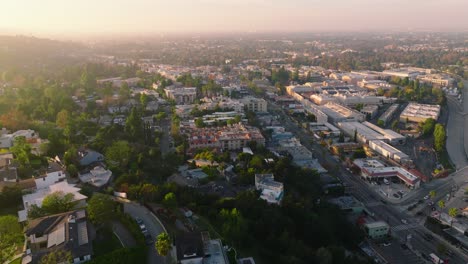 Bright-Sunny-Daytime-Drone-Shot-of-Studio-City-in-Los-Angeles,-CBS-Studio-Lots-and-Businesses-Below