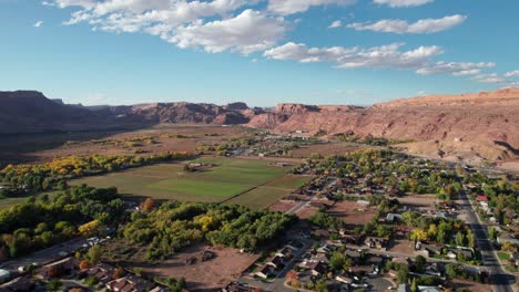 High-elevation-drone-shot-panning-over-the-north-side-of-moab,-utah