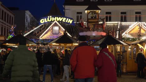 People-drinking-mulled-wine-and-strolling-streets-at-Christmas-Market