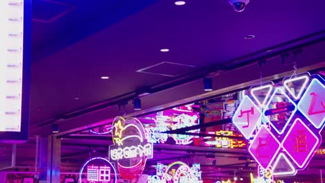 Tilt-down-revealing-vibrant-electric-center-of-entertainment-in-Tokyo-Japan