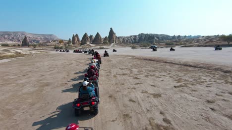 ATV-Tour-In-Cappadocia---Tourists-On-Quad-Bike-Driving-In-Cappadocia,-Turkey-On-Sunny-Day