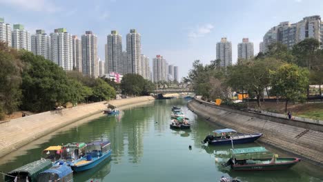Lam-Tsuen-River-runs-through-urban-developments-in-the-New-Territories,-Tai-Po,-Hong-Kong