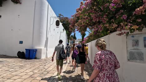 Tourists-are-walking-in-Sidi-Bou-Said,-Tunisia