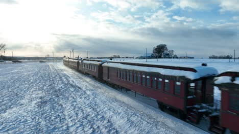 Aerial-view-of-a-passenger-train-on-a-snowy-day