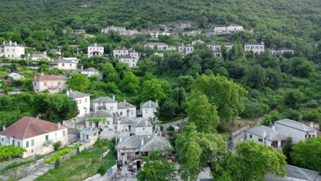 Aerial-panoramic-view-over-the-picturesque-village-Papigo-in-Epirus,-Greece-at-sunset
