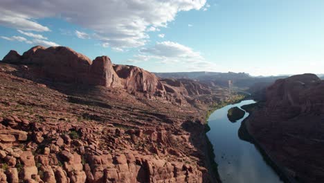 Dramatic-drone-shot-of-the-colorado-river-in-a-canyon-outside-of-moab,-utah