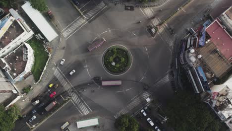 Cinematic-aerial-video-of-a-roundabout-and-vehicles-moving-from-signal-with-less-traffic