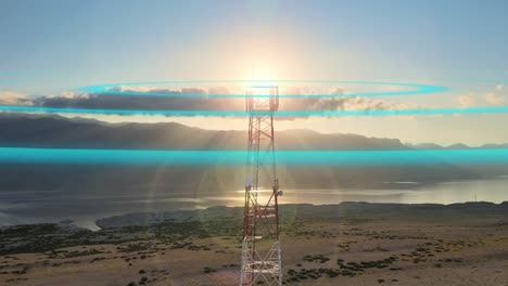 Aerial-of-5G-tower-Telecom-station-in-nature-with-seascape-at-sunset,-animation-Graphic-Motion-of-micro-wave-air-Electromagnetic-pollution-concept