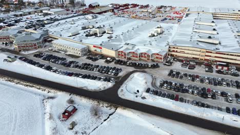 Aerial-over-Väderstad-AB---Agricultural-machine-factory-facilities---sunny-and-snowy-conditions