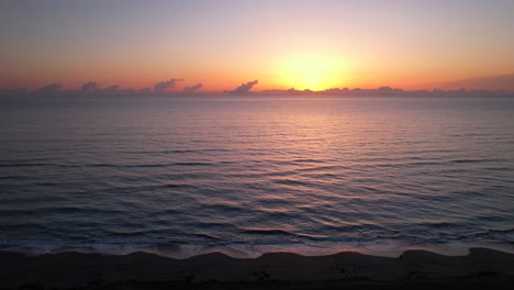 sunrise-beach-ocean-side-scrolling-aerial-view