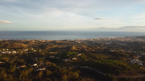 Ocean-coastline-and-white-buildings-of-Spain,-aerial-drone-view