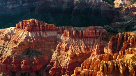 Telephoto-drone-shot-tilting-over-rugged-nature,-in-Bryce-Canyon,-golden-hour-in-USA