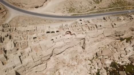 Wonderful-archeology-aerial-drone-shot-old-building-historical-village-traditional-ancient-life-in-silk-road-side-in-Iran-cultural-landscape-of-settlement-castle-fortress-in-Fars-Izadkhast-ruins-scene