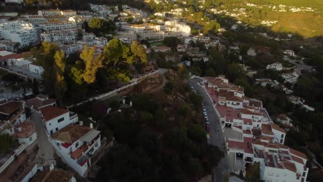 Private-villas,-narrow-streets-and-Mijas-township,-aerial-view
