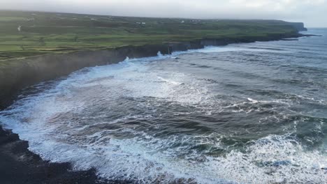 Rough-sea-waves-breaking-on-beach-of-Doolin-in-Ireland