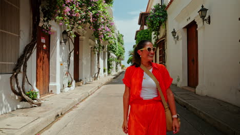 Young-female-traveler-discovering-the-empty-streets-of-Cartagena-de-las-Indias-old-historic-town