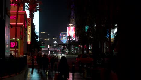 People-Walking-On-The-Sidewalks-At-Night-In-The-City-Of-Las-Vegas,-Nevada,-USA