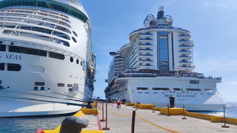 Witness-the-grandeur:-Two-majestic-cruise-ships-grace-the-same-pier,-side-by-side,-offering-breathtaking-spectacle-of-maritime-elegance-and-grandeur