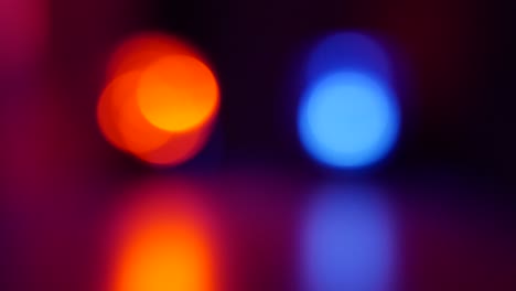 Defocused-Police-Red-Blue-Emergency-Lights-Flashing-In-The-Dark