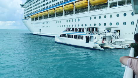 tendering-boat-sits-by-the-cruise-ship-gate,-offering-smooth-transition-for-passengers-to-move-between-ship-and-shore,-ensuring-convenient-and-efficient-travel-during-their-maritime-journey