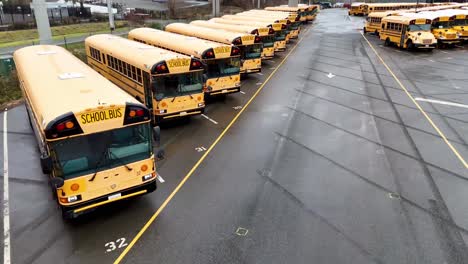 School-buses-parked-in-the-Edmond-School-District-Transportation-Center-in-Lynnwood,-Washington-near-the-Interurban-Trail