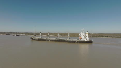 An-aerial-view-of-an-oil-chemical-tanker-steaming-up-the-Houston-Ship-Channel-on-a-clear,-sunny-day-in-Houston,-Texas