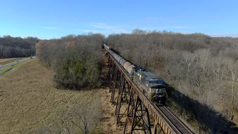 Aerial-Show-Following-a-Norfolk-Southern-Engine-on-the-End-of-a-Mixed-Freight-Train-Crossing-the-Pope-Lick-Trestle-in-Louisville-Kentucky-on-a-Sunny-Winter-Day