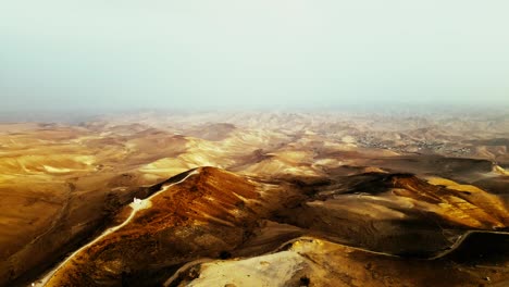 Extreme-brown-dry-desert,-dust-and-haze-to-the-end-of-the-horizon,-saturated-brown-color