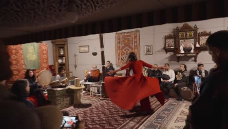 Woman-Dances-Sufi-Whirling-Dervishes-Circle-Dance-In-Seb-i-arus-Slow-Motion-Shot-around-People-Watching