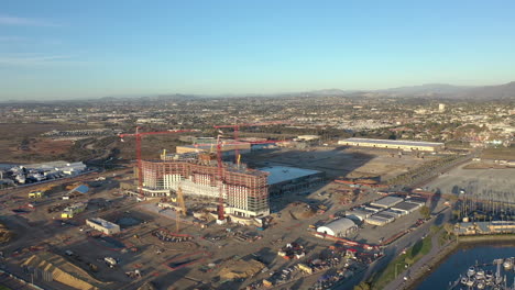The-new-convention-center-being-build-in-Chula-Vista-California,-with-San-Diego-skyline-in-the-distance