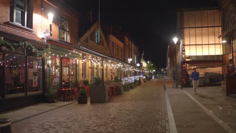 A-view-of-a-street-in-Altrincham-at-night-in-Manchester,-England