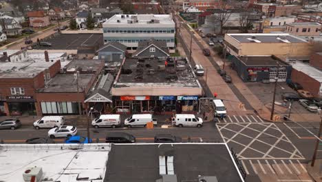 An-aerial-view-of-store-fronts-after-a-fire-on-a-cloudy-day