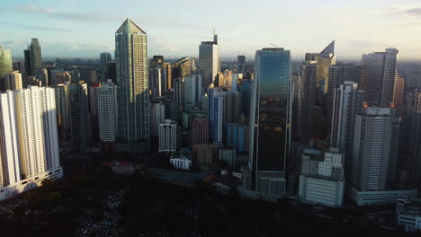 Aerial-view-flying-around-buildings-in-Makati-Central-Business-District,-Manila
