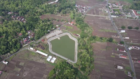 aerial-view,-Imogiri-Embung-or-Imogiri-reservoir-in-Imogiri-Bantul-which-is-a-place-to-accommodate-the-flow-of-rainwater-which-has-a-shape-like-a-puppet-mountain