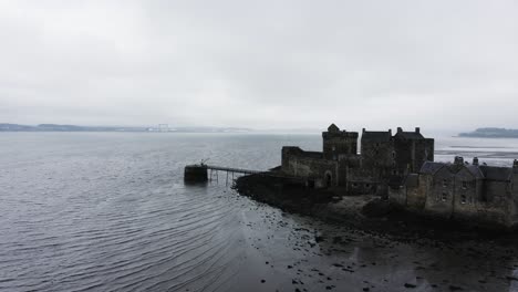 Drone-shot-of-Blackness-Castle,-filming-site-of-Outlander-on-the-coast-of-Scotland
