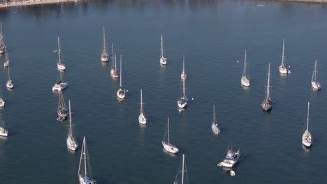 Sailboats-anchored-in-Coronado-Bay,-California---aerial-parallax-San-Diego