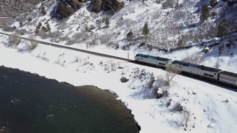 Amtrak-California-Zephyr-train-rolls-through-Glenwood-Canyon,-Colorado