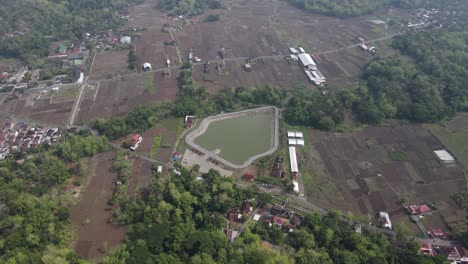 aerial-view,-Imogiri-Embung-or-Imogiri-reservoir-in-Imogiri-Bantul-which-is-a-place-to-accommodate-the-flow-of-rainwater-which-has-a-shape-like-a-puppet-mountain