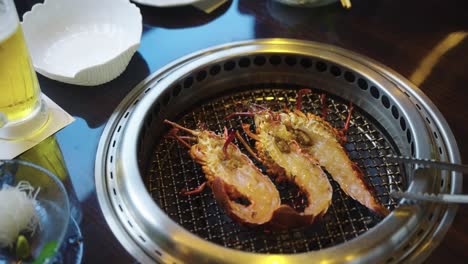 Fresh-Ise-Ebi,-Japanese-Spiny-Lobsters-halved-and-placed-on-Barbecue-Grill-4k