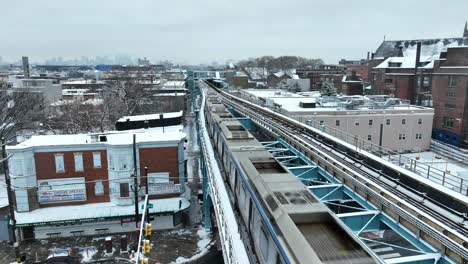 SEPTA-passenger-train-in-Kensington,-Philadelphia-on-snowy-day