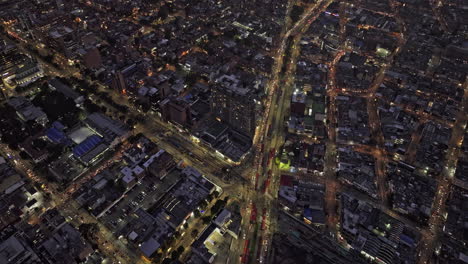 Bogota-Colombia-Aerial-v24-flyover-Avenida-Caracas-capturing-busy-traffics,-illuminated-cityscape-across-Quinta-Camacho,-Chapinero-and-Barrios-Unidos-at-night---Shot-with-Mavic-3-Cine---November-2022